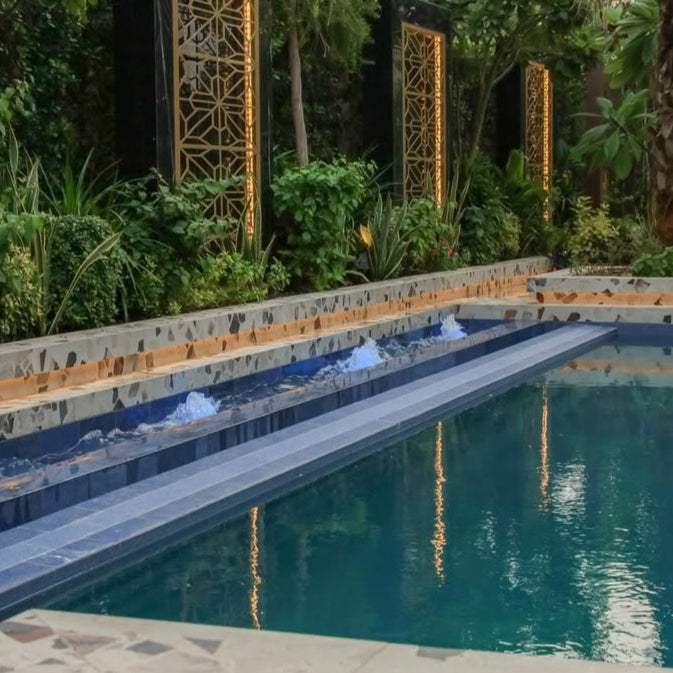 Pool area with decorative elements and greenery
