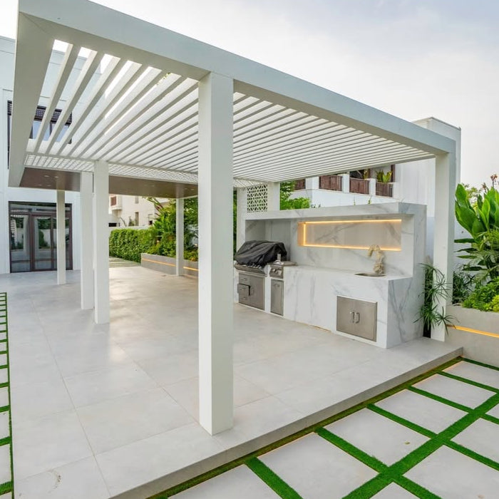 Modern outdoor kitchen with pergola and pool area