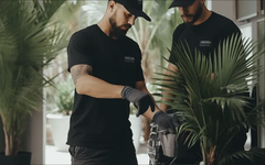 An indoor plant being tended during a maintenance visit