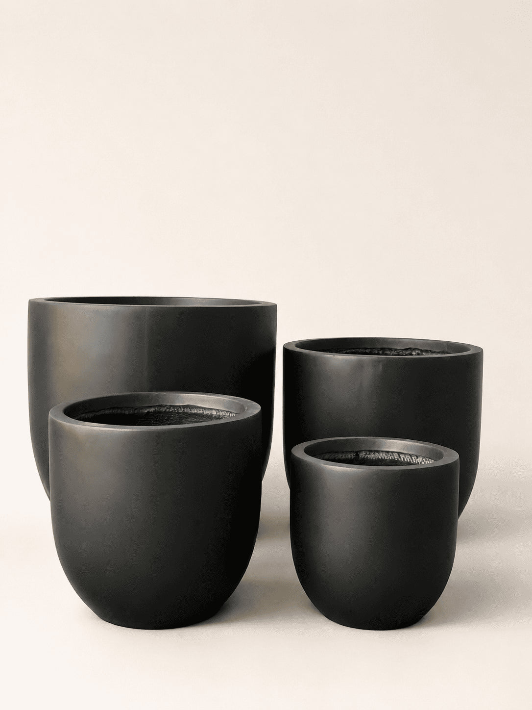 Black matte fiber clay plant pot set, four round pots in nesting sizes
