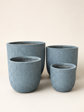 Grey textured fiber planter pots set of 4, cylindrical with subtle embossed pattern
