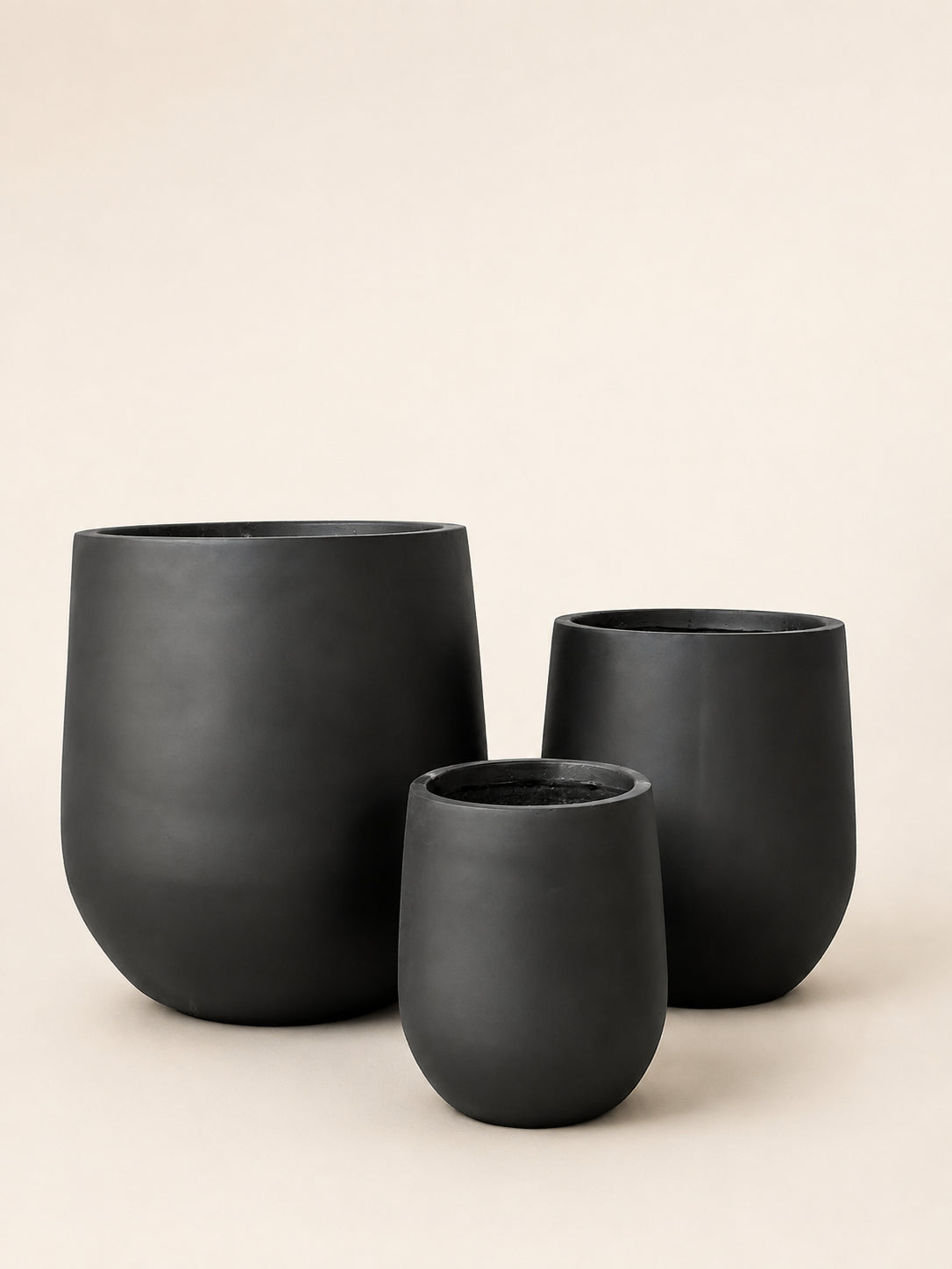 Matte black fiber plant pot set of three nesting cylinders, rounded rims