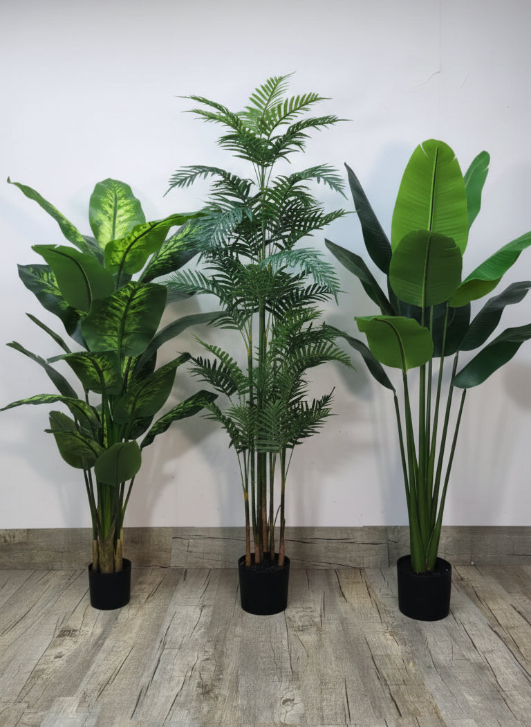 Artificial living room set of three faux plants in black pots with green leaves