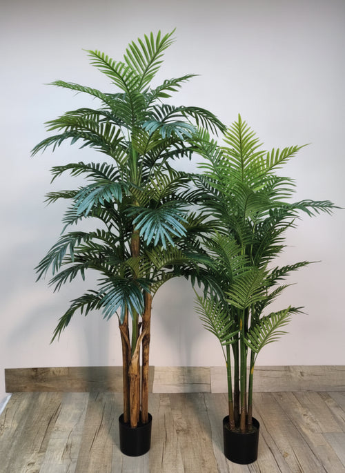 Artificial palms duo: two green faux palm trees in black pots with brown trunks