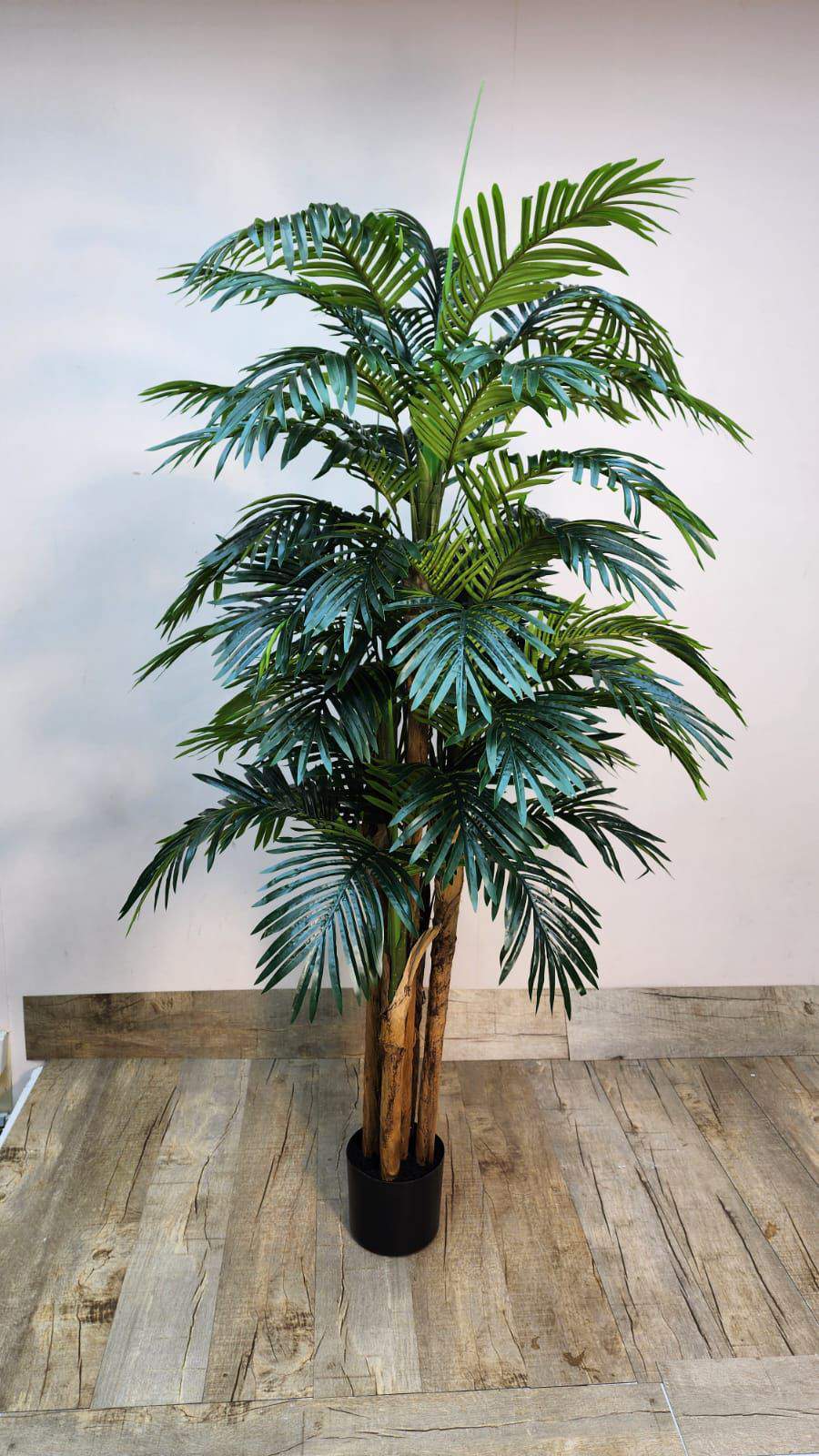 Artificial Kentia palm plant with green fronds in a dark pot.