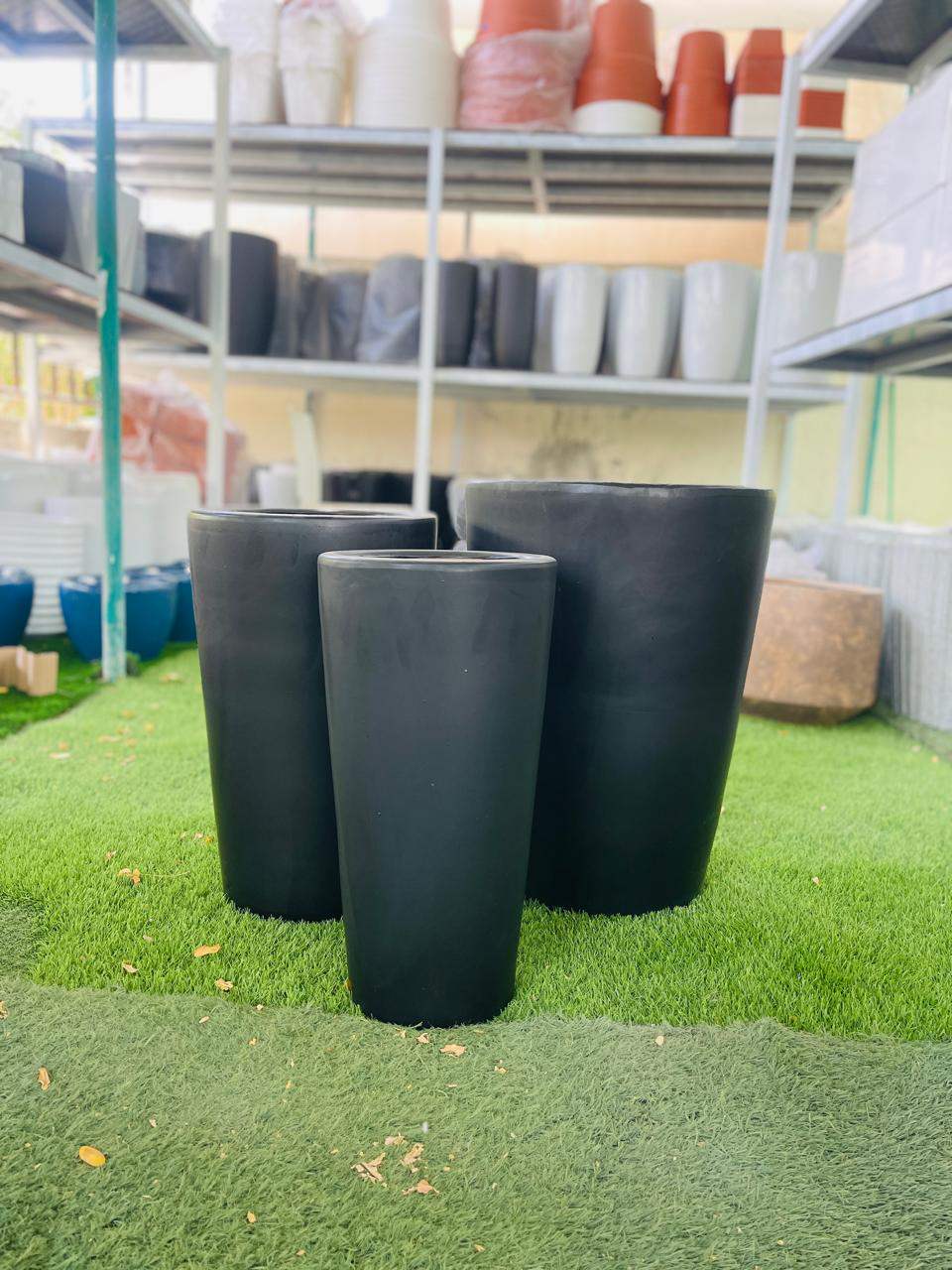 Matte black ceramic tall pot with smooth rounded rim, cylindrical shape