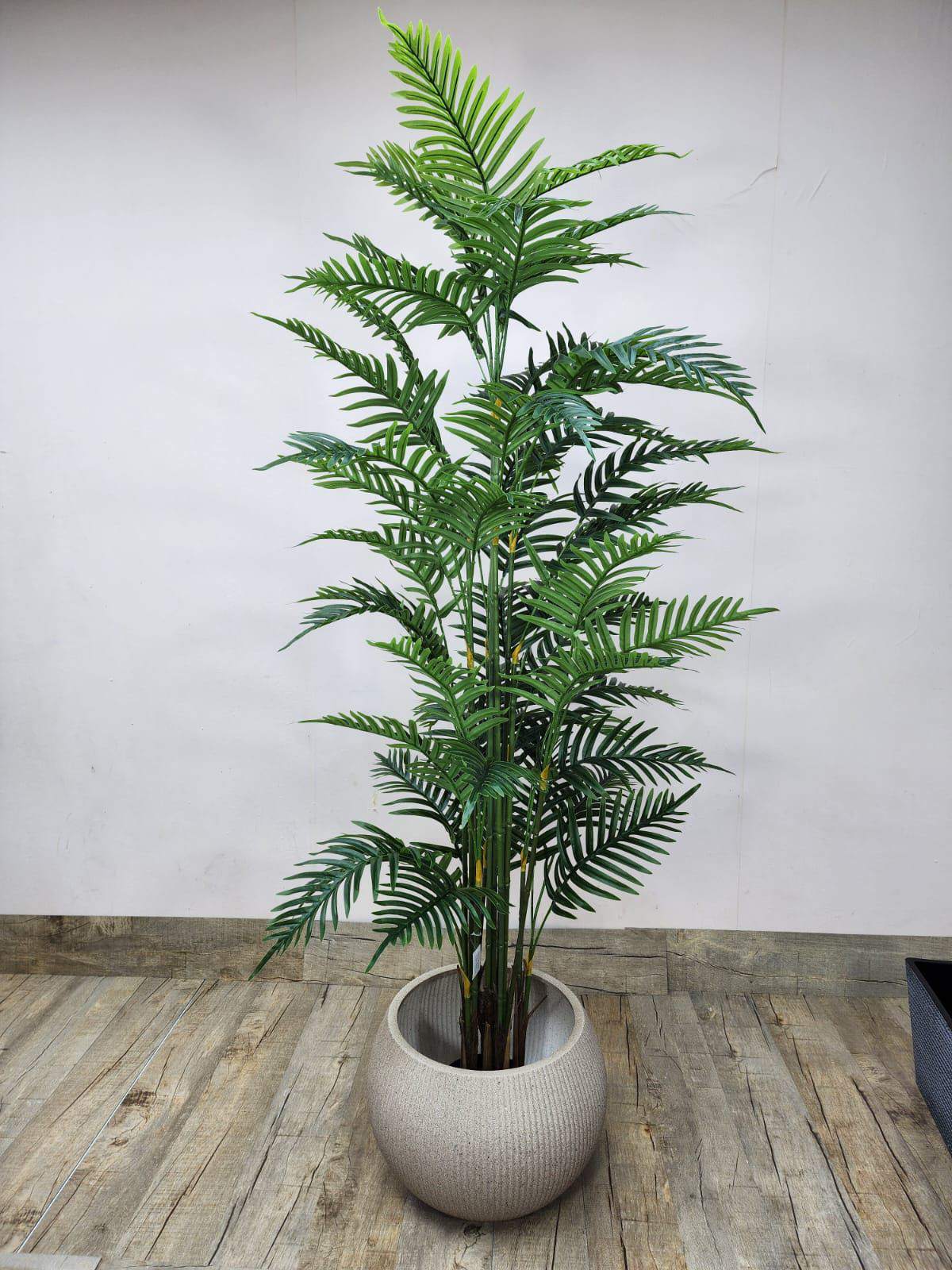 Artificial areca palm with green fronds in grey textured planter, upright stems