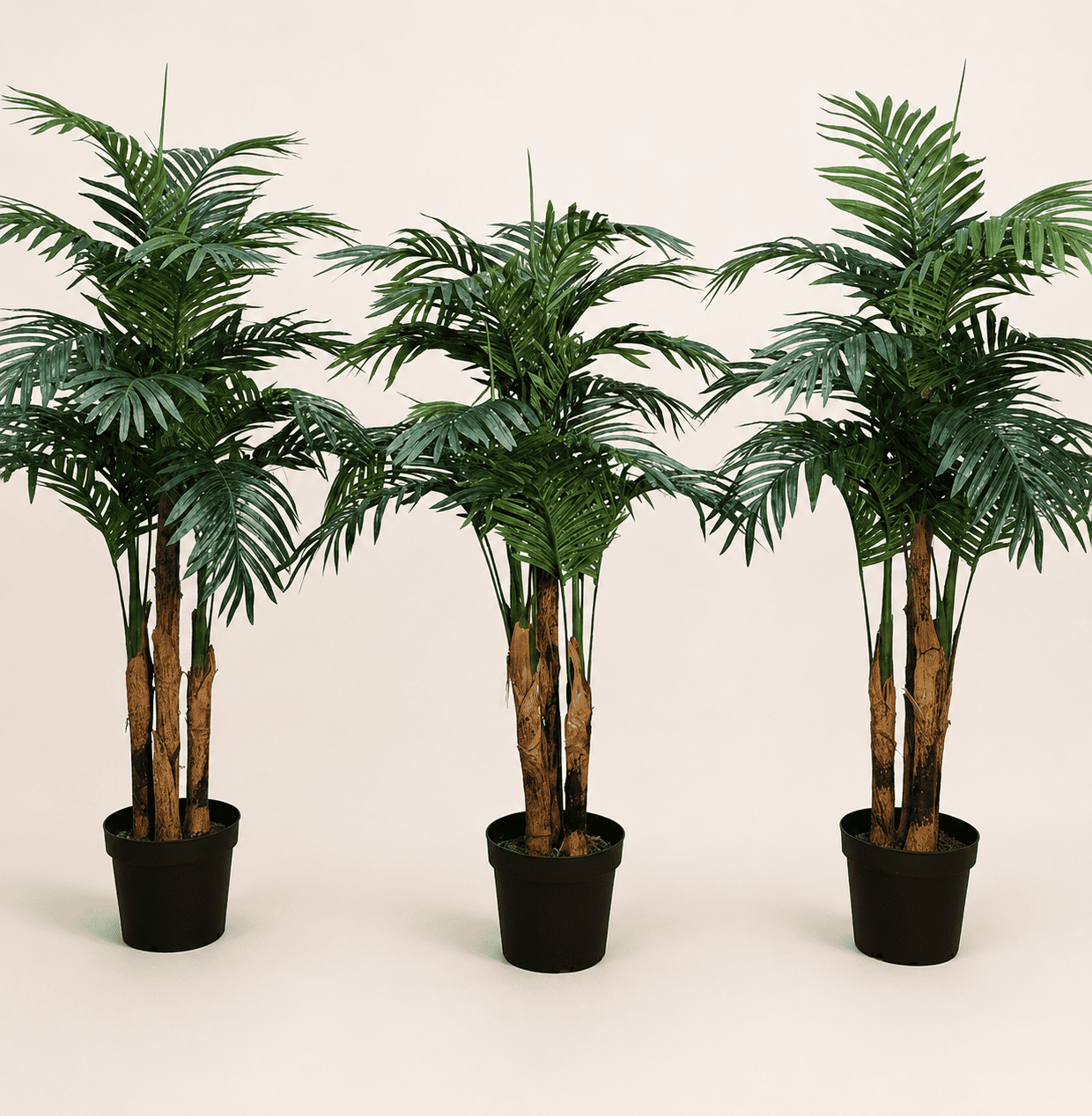Artificial areca palm trio with green fronds and three slender trunks in black pots
