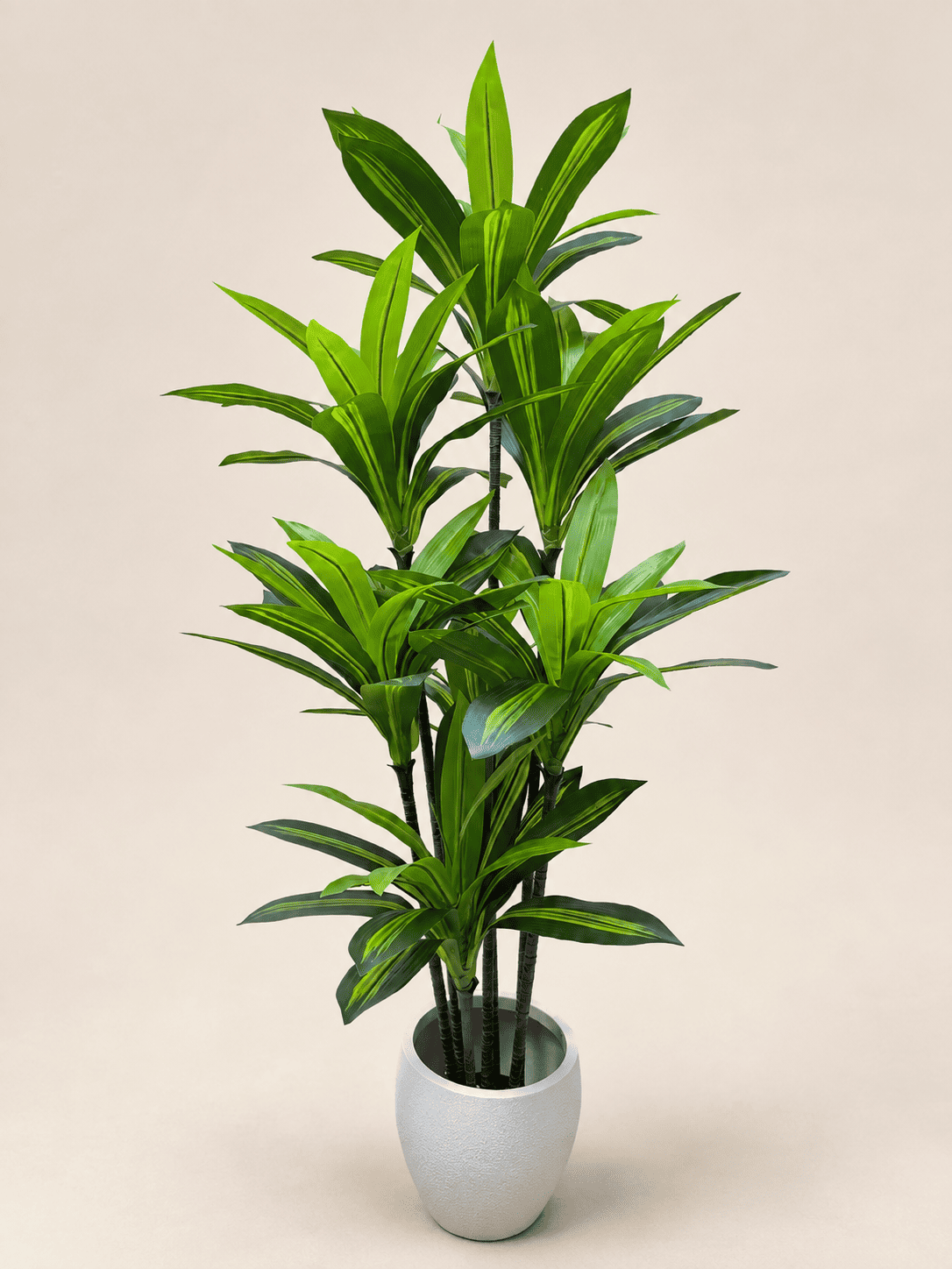Artificial dracaena in light gray pot, tall stems with narrow green leaves