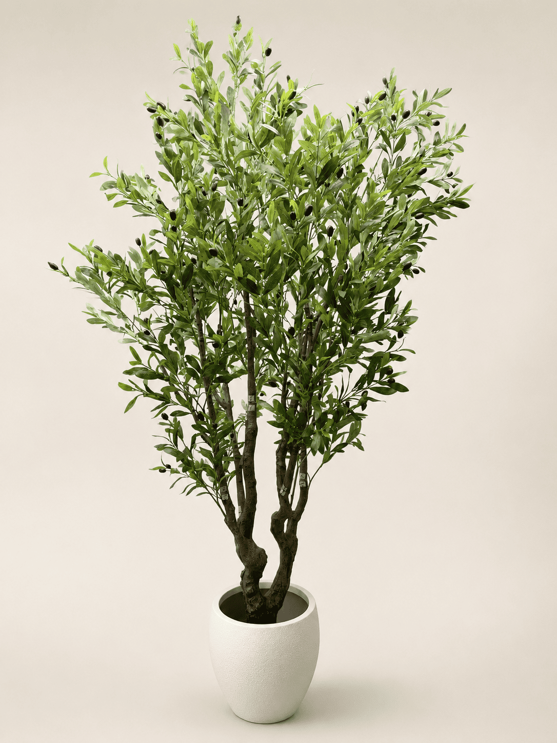 Large artificial olive tree with green leaves in a white pot