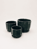 Set of three glossy ceramic low pots, dark black-green, square shape with flared rims
