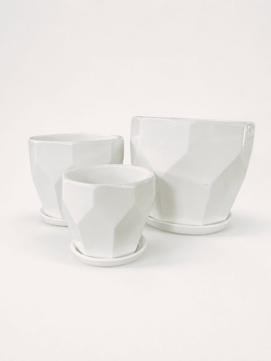 White ceramic low pots set of three, square-cut profile, open top.
