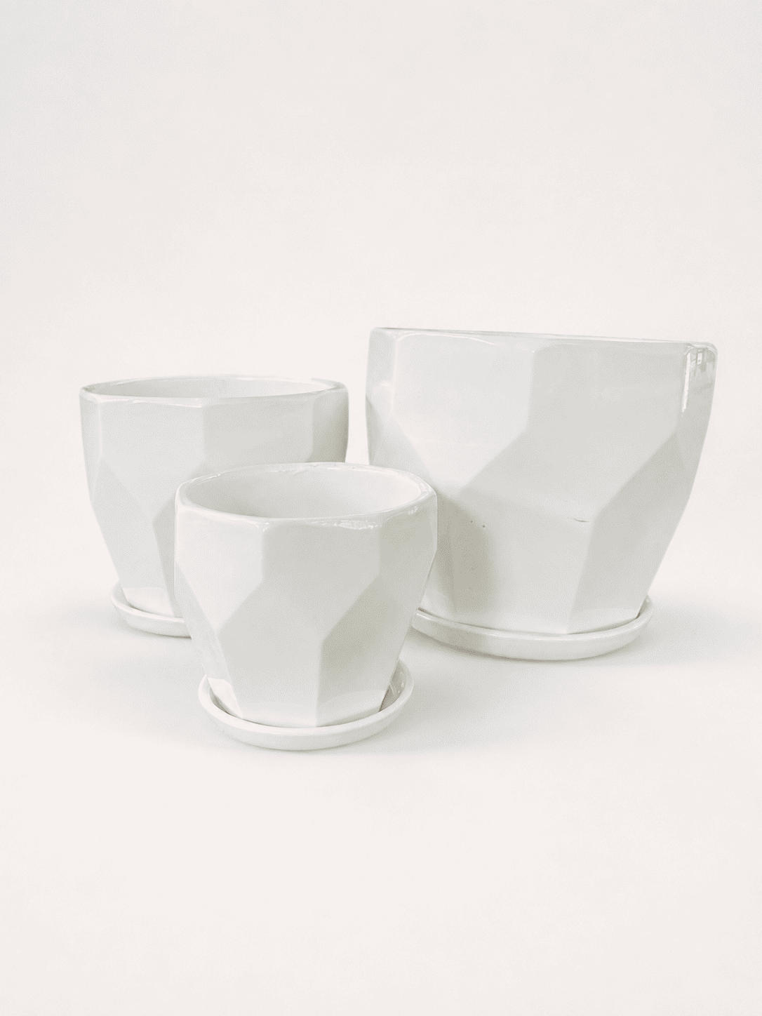 White ceramic low pots set of three, square-cut profile, open top.