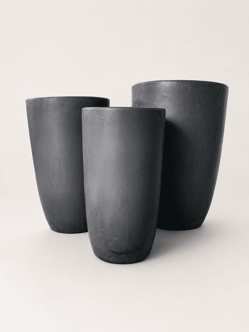 Matte black ceramic tall pots set of three, rounded flared rims, textured finish