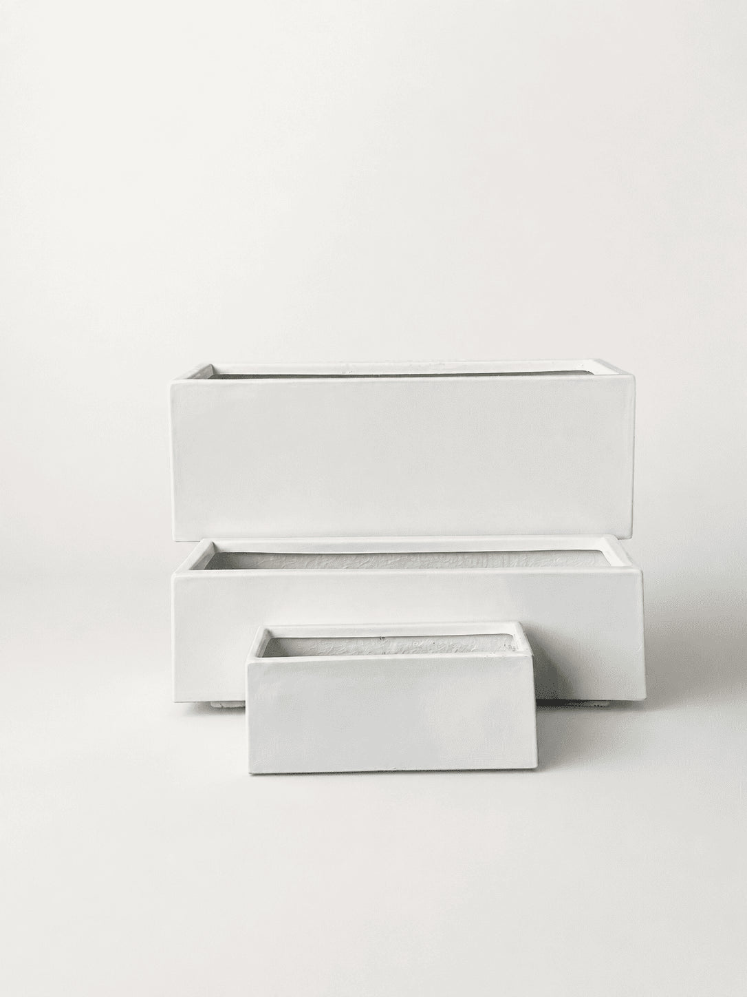 Rectangular long white fiberglass planter pot with smaller matching pot in front