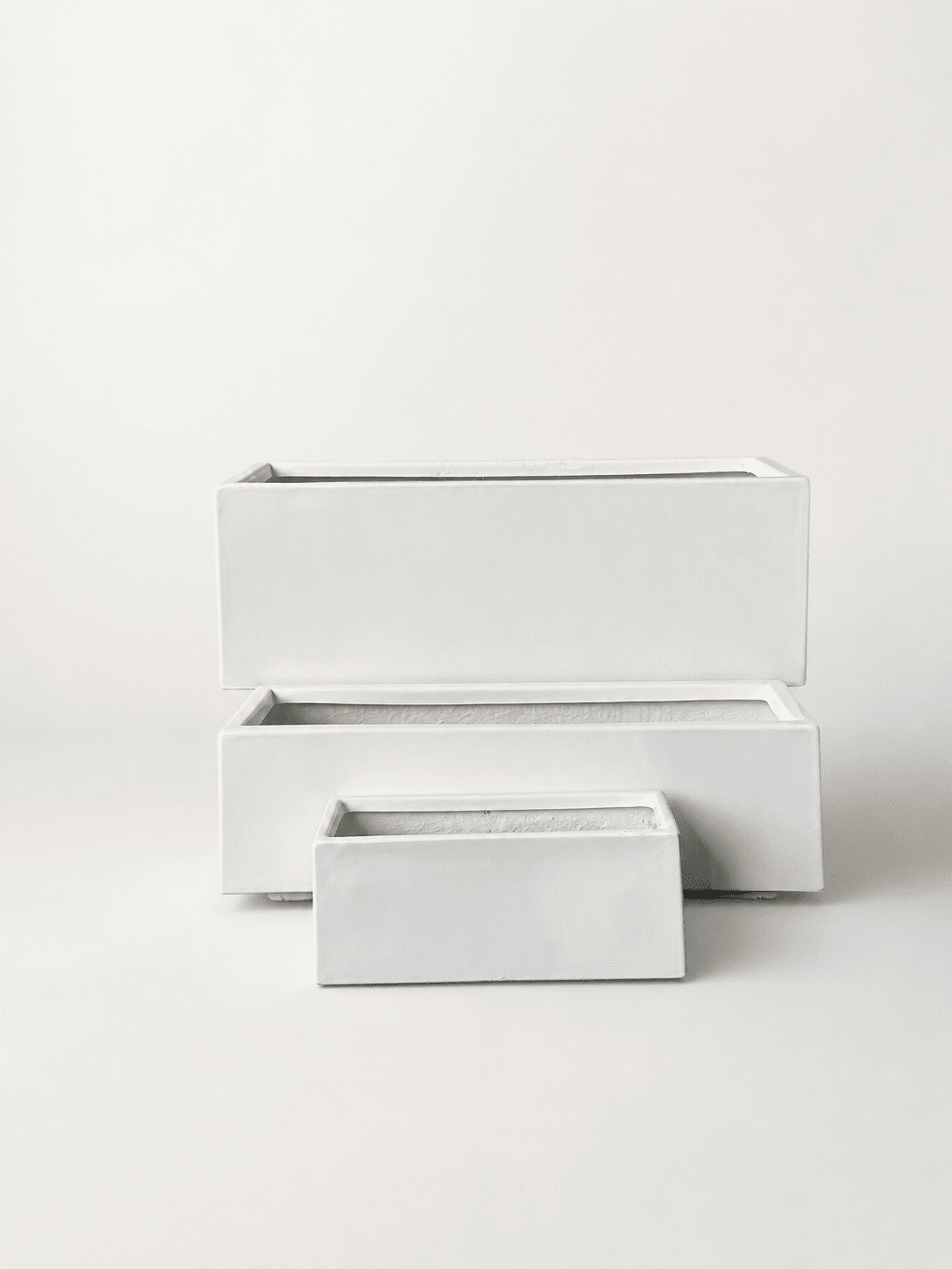 Rectangular long white fiberglass planter pot with smaller matching pot in front