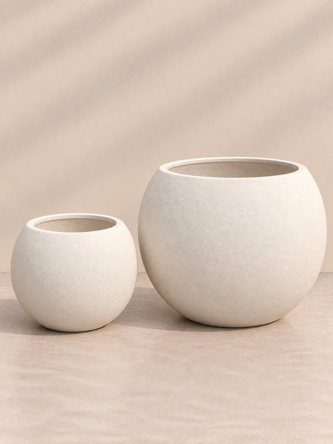 Globe Planter in cream, small and large round fiberglass planters