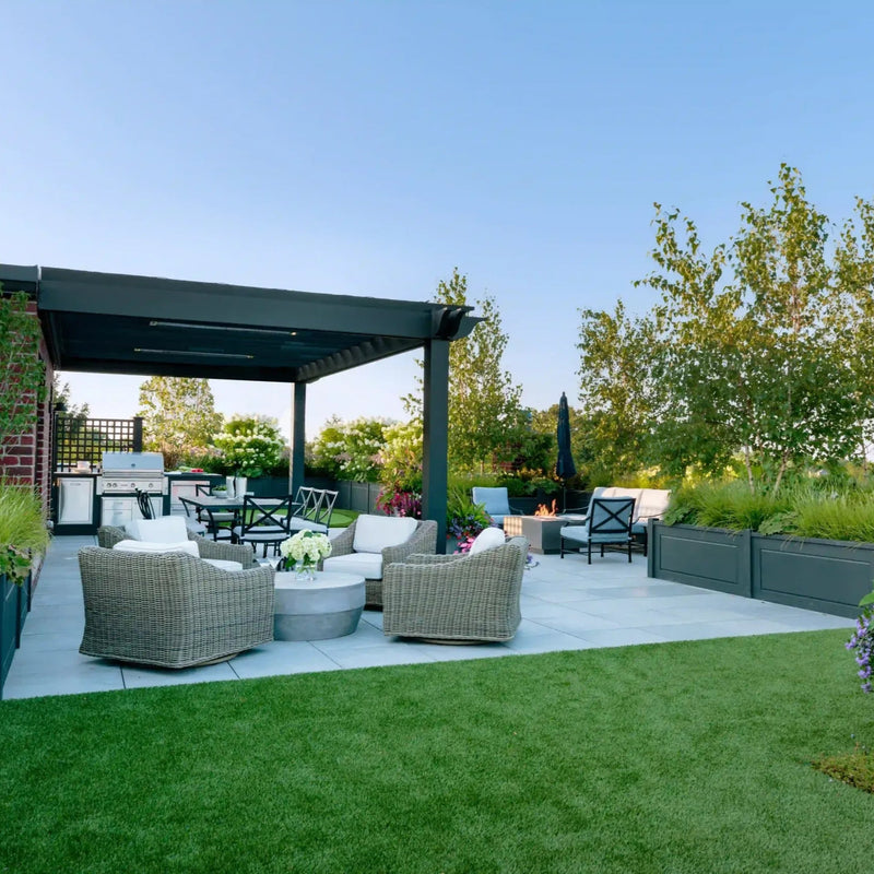 Outdoor patio area with furniture and plants on a sunny day