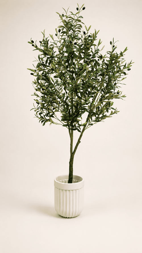 Artificial olive tree with green leaves in white ribbed ceramic pot