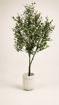 Artificial olive tree with green leaves in white ribbed ceramic pot