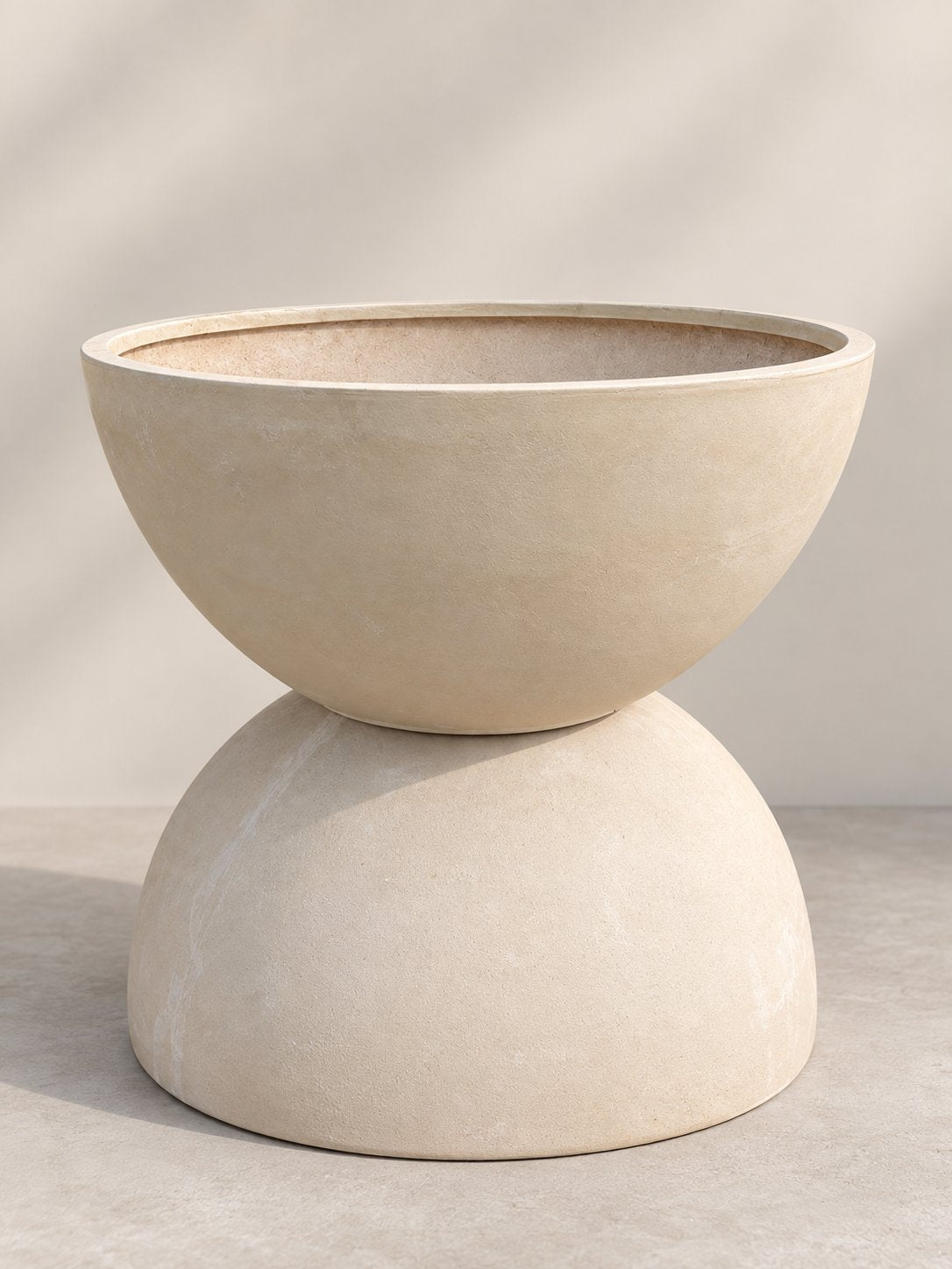 Shallow Bowl Planter in cream, wide fiberglass bowl shown resting on another planter