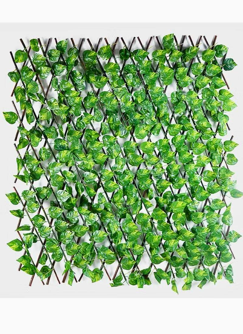 Artificial expandable trellis with green leaf vines and interwoven twig grid